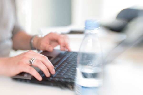 writing on laptop