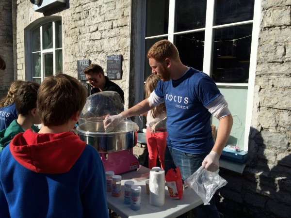 One of our team members, Randy making cotton candy. He had an adorable helper, too.